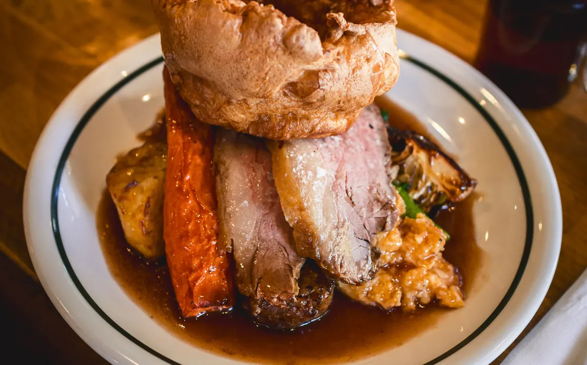 Roast beef Sunday lunch with yorkshire pudding, carrots and gravy